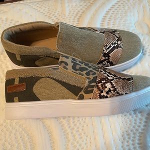 Brand new shoes, tan with some animal print.